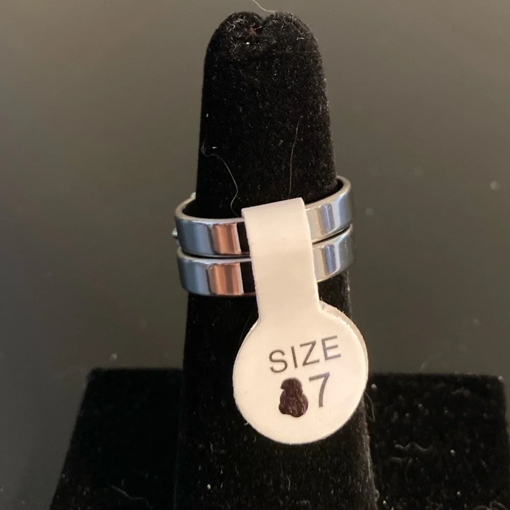 Size 7 silver tone ring with cross emblem. Has two pieces!